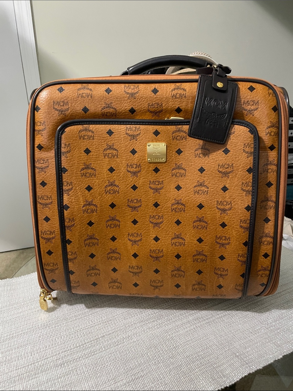 MCM Cognac Monogram Rolling Carry-On with Black Trim